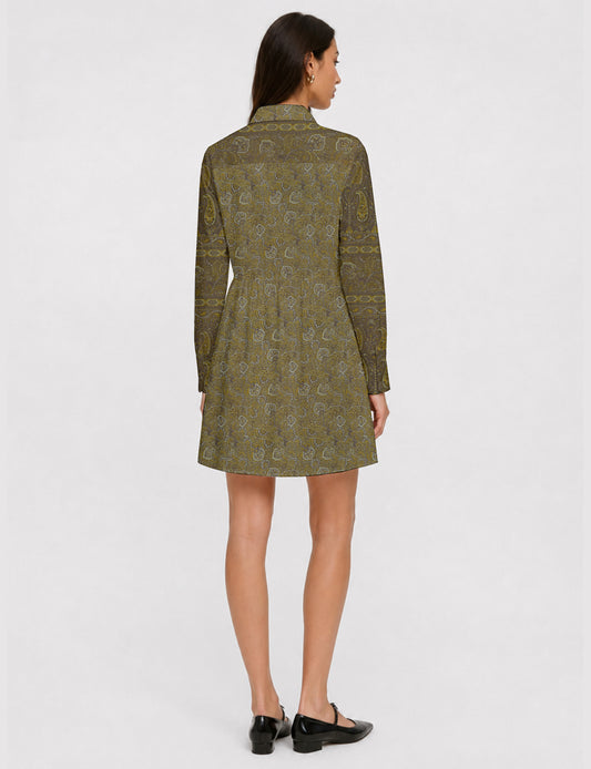 Short shirt dress with a relaxed A-line silhouette, point collar, partial button placket, gathered waist, side pockets, and full-length cuffed sleeves.