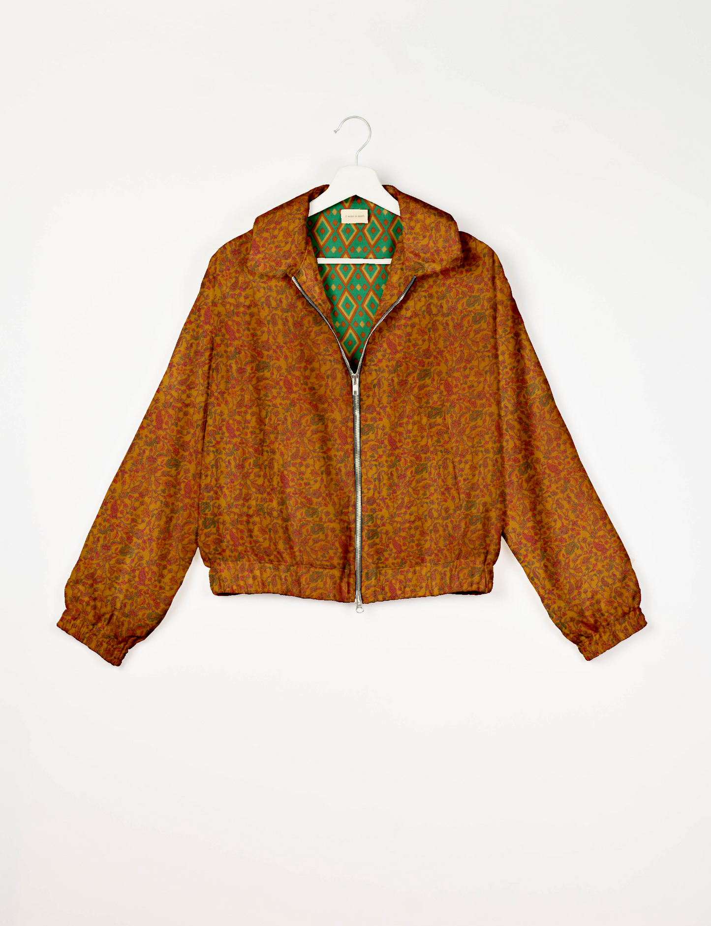 Upcycled Bomber Jacket made from recycled sari materials, featuring a cute cropped shape, elasticated hem and cuffs, and contrast sari print lining. Sustainable apparel promoting eco-friendly fashion and ethical clothing.