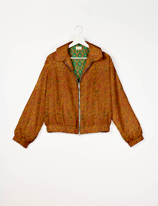 Upcycled Bomber Jacket made from recycled sari materials, featuring a cute cropped shape, elasticated hem and cuffs, and contrast sari print lining. Sustainable apparel promoting eco-friendly fashion and ethical clothing.