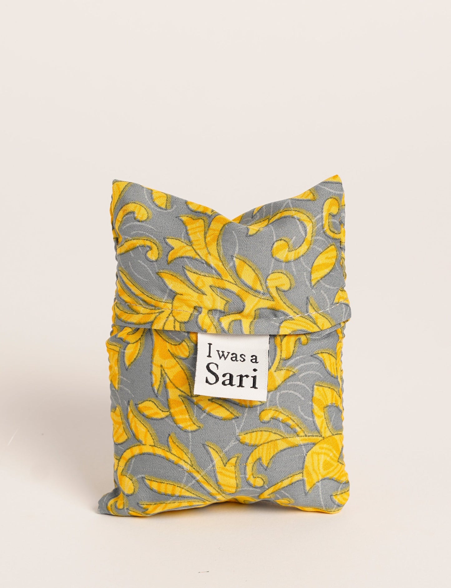 Stay eco-conscious with our Reusable Bag, handmade by Indian artisans from pre-loved saris. Silky and lightweight, this foldaway bag is perfect for your on-the-go lifestyle. Each piece is a unique statement of ethical fashion, embracing sustainability and style.