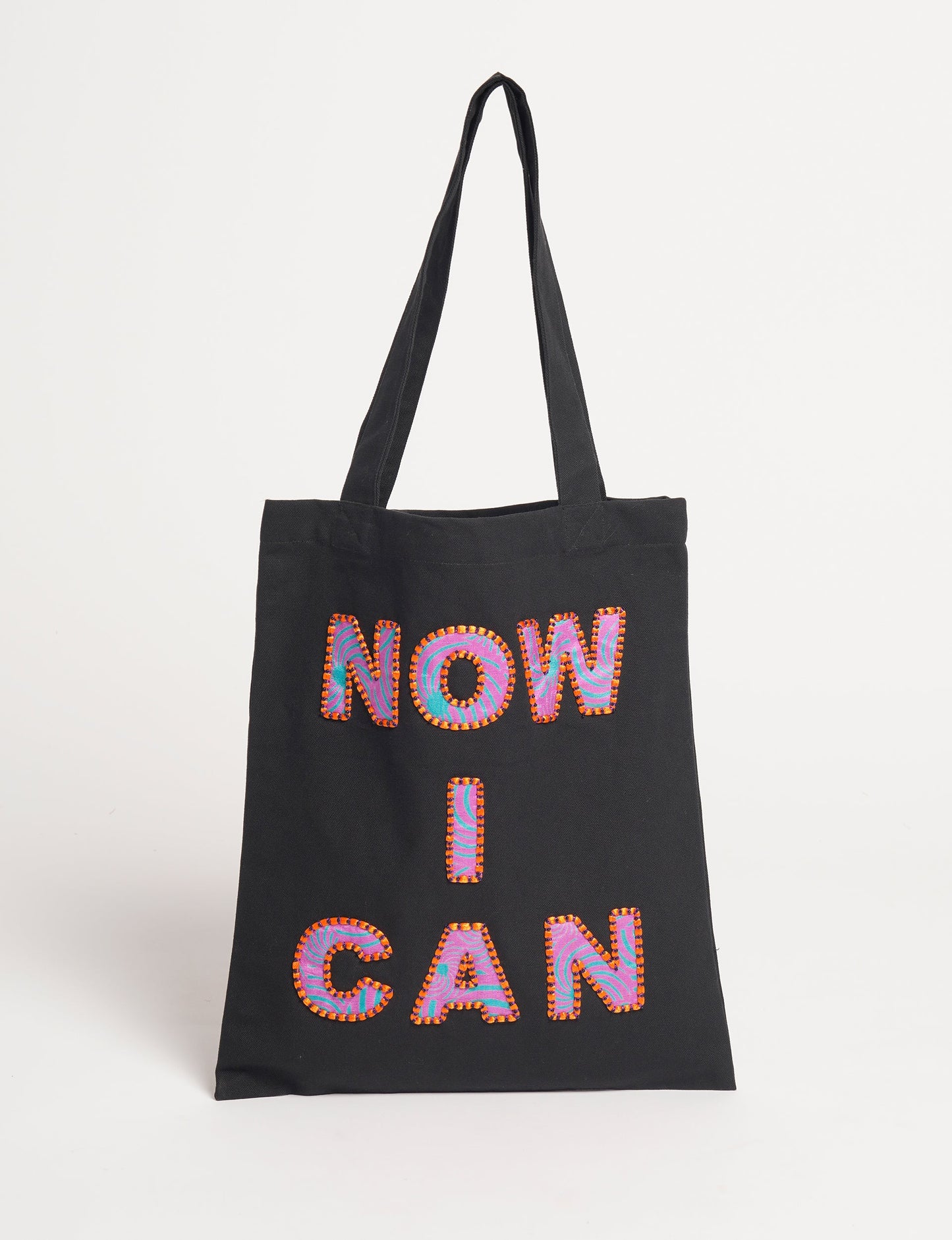 Discover empowerment with our NOW I CAN TOTE BAG – a distinctive piece from our embroidery collection, commemorating positive transformations in the lives of our women artisans. Each bag signifies empowerment, from community pride to supporting education dreams. Carefully crafted with embroidered signatures, these bags are not only visually appealing but also embody the artisans' journeys and the reincarnation of pre-loved saris into a new form – as your treasured bag.