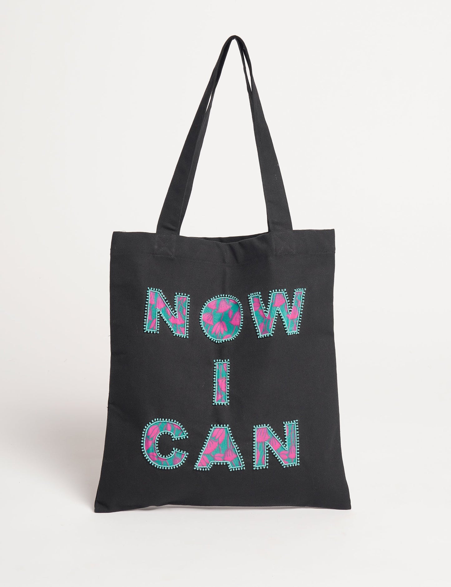 Discover empowerment with our NOW I CAN TOTE BAG – a distinctive piece from our embroidery collection, commemorating positive transformations in the lives of our women artisans. Each bag signifies empowerment, from community pride to supporting education dreams. Carefully crafted with embroidered signatures, these bags are not only visually appealing but also embody the artisans' journeys and the reincarnation of pre-loved saris into a new form – as your treasured bag.