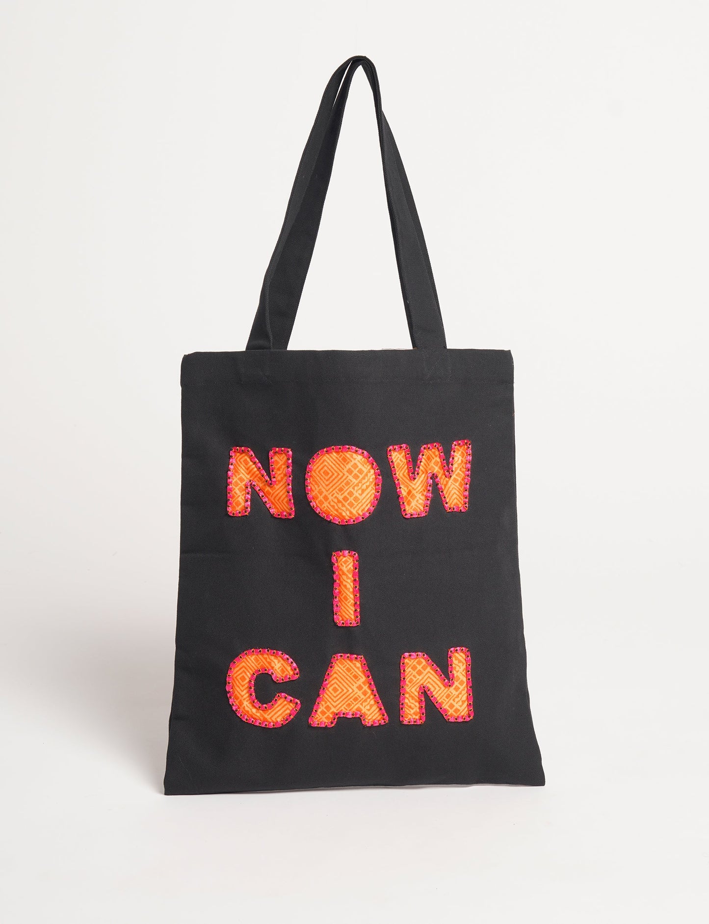 Discover empowerment with our NOW I CAN TOTE BAG – a distinctive piece from our embroidery collection, commemorating positive transformations in the lives of our women artisans. Each bag signifies empowerment, from community pride to supporting education dreams. Carefully crafted with embroidered signatures, these bags are not only visually appealing but also embody the artisans' journeys and the reincarnation of pre-loved saris into a new form – as your treasured bag.