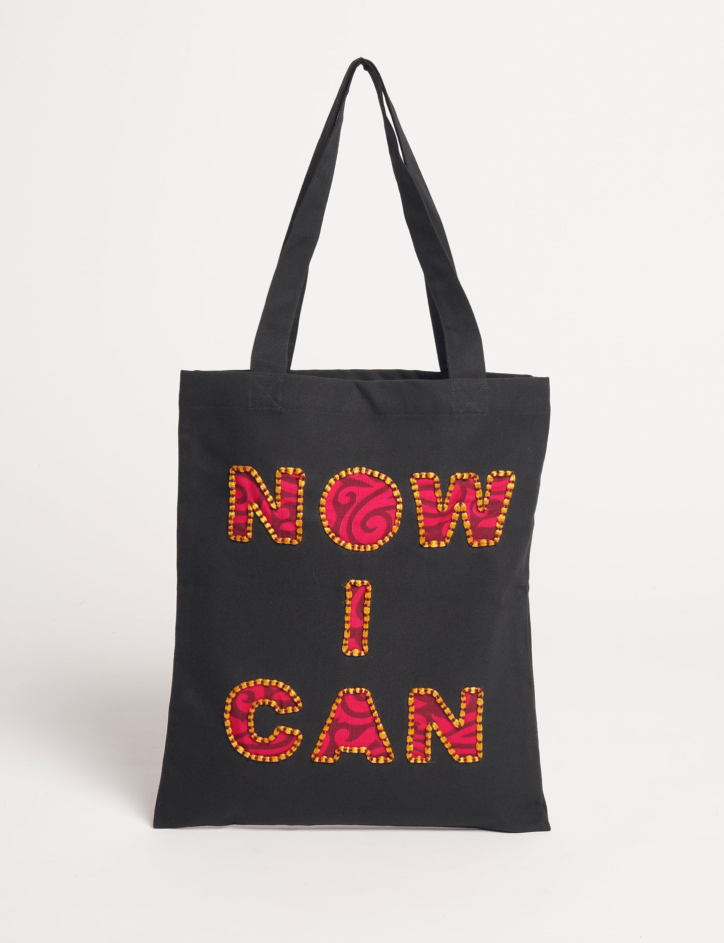 Discover empowerment with our NOW I CAN TOTE BAG – a distinctive piece from our embroidery collection, commemorating positive transformations in the lives of our women artisans. Each bag signifies empowerment, from community pride to supporting education dreams. Carefully crafted with embroidered signatures, these bags are not only visually appealing but also embody the artisans' journeys and the reincarnation of pre-loved saris into a new form – as your treasured bag.