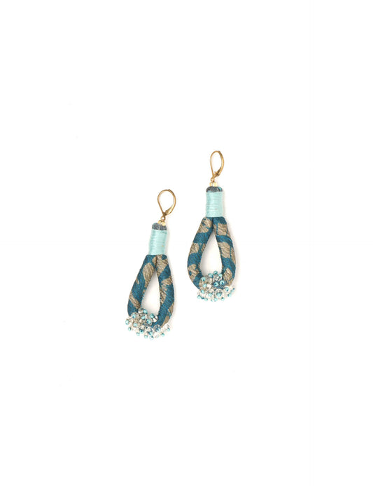 Discover the charm of Beaded Drop Earrings, meticulously crafted by Indian artisans. Recycled cotton rope, sari fabric, and surplus glass beads create an eco-friendly masterpiece. Hypoallergenic metal hooks ensure both style and comfort.