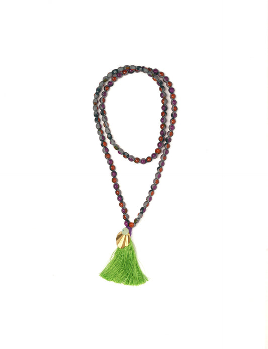 Discover elegance in our Beaded Tassel Necklace, meticulously handcrafted with glass beads, a silk tassel, and a metallic pendant. Hypoallergenic metal hooks provide a skin-friendly and stylish accessory. Length: 57 cm / 22.5 inches.