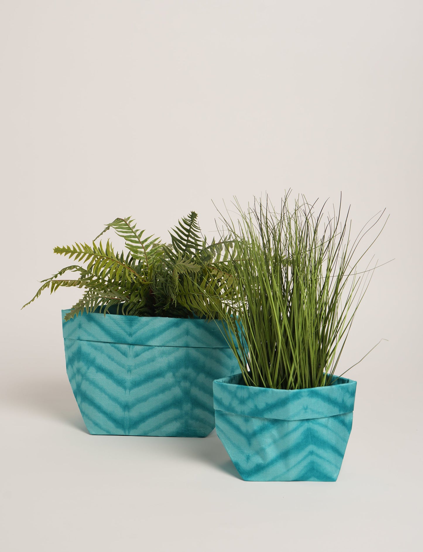 Upgrade your plant aesthetics sustainably with our PLANT POT COVER SET – two handmade covers crafted from preloved saris. Ethical and green, these covers bring eco-friendly charm to your plants and your space.