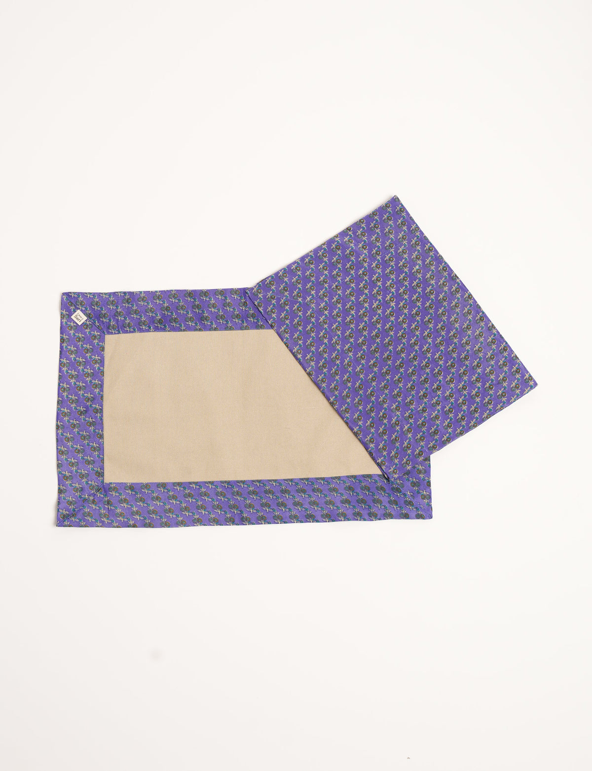 Set of four canvas placemats with beige center and purple micro floral border, shown flat on white background