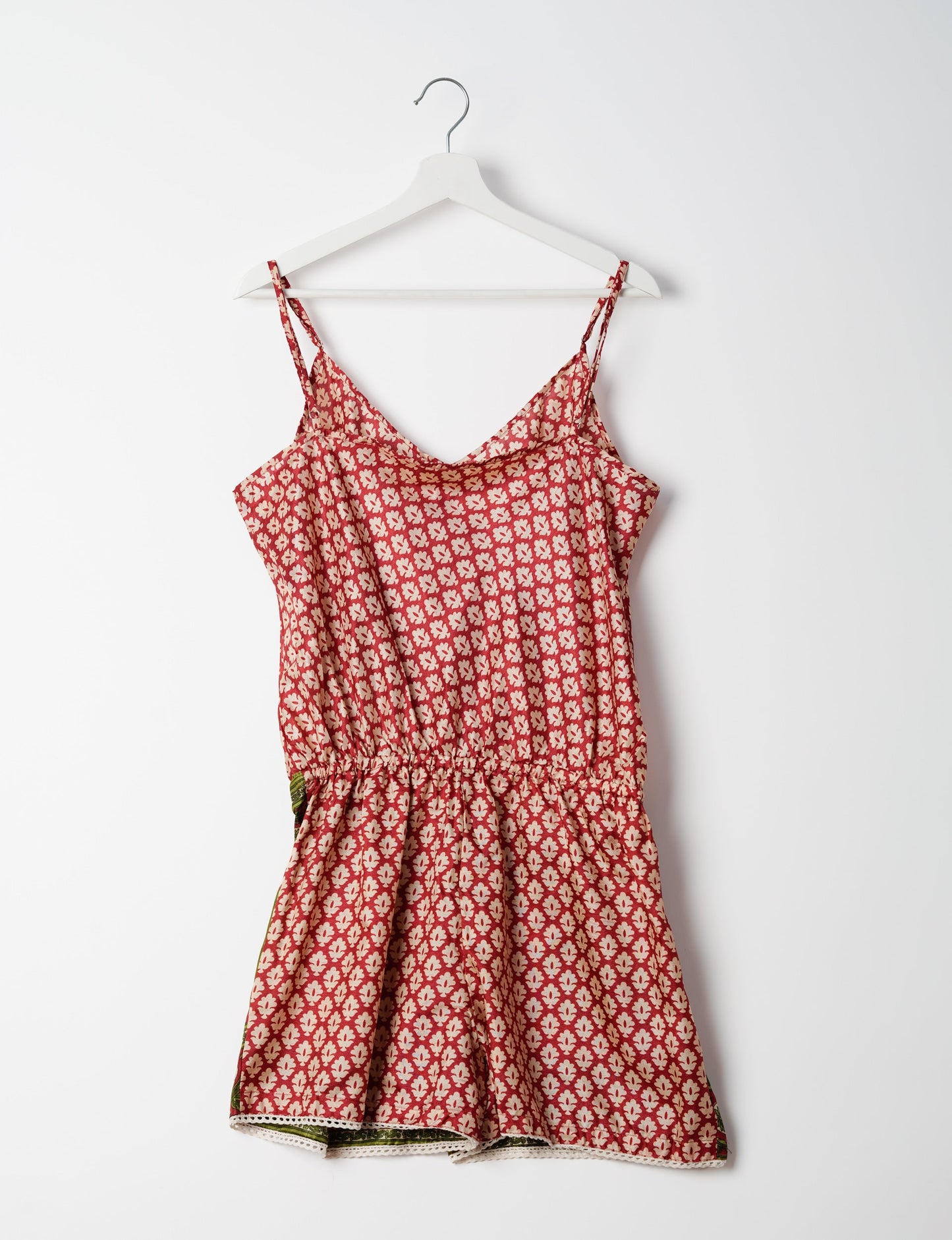 Vibrant playsuit with lace accents, crafted from upcycled saris. Embrace ethical fashion with this unique piece designed for conscious consumers.